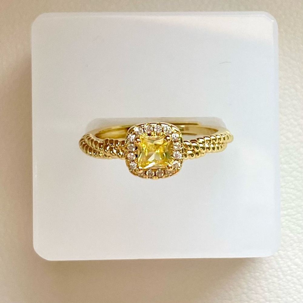 Gold Ring with Yellow Gemstone and Halo Accent